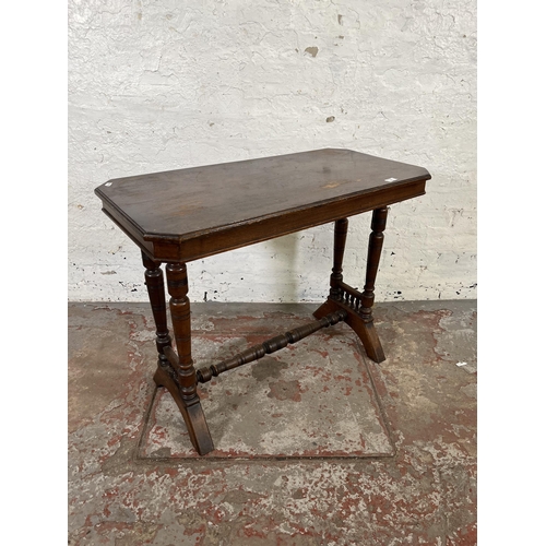 42 - A Victorian Aesthetic Movement mahogany side table with lower stretcher