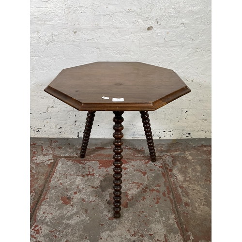 43 - A Victorian mahogany octagonal side table with bobbin turned supports