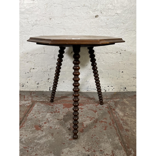 43 - A Victorian mahogany octagonal side table with bobbin turned supports