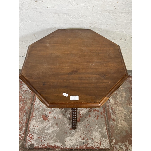 43 - A Victorian mahogany octagonal side table with bobbin turned supports