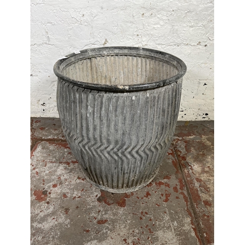 46 - A galvanised dolly tub - approx. 48cm high x 44cm diameter