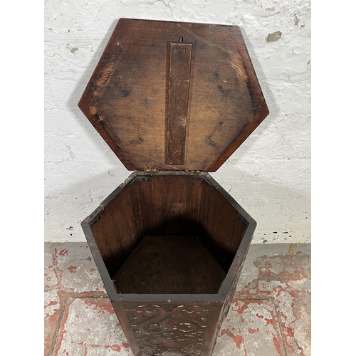 49 - A late 19th/early 20th century Anglo Indian carved mahogany hexagonal side table with hinged lid