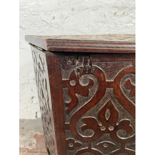 49 - A late 19th/early 20th century Anglo Indian carved mahogany hexagonal side table with hinged lid