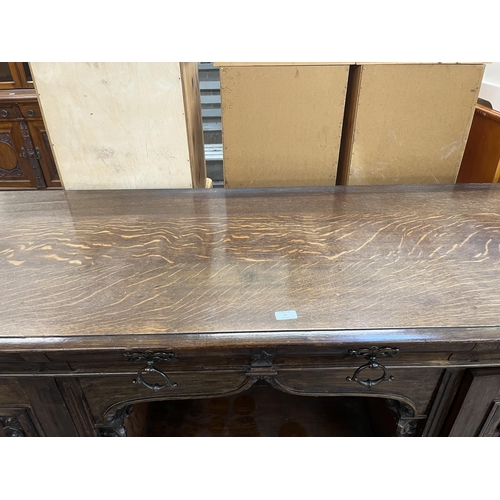 50 - A 19th century carved oak sideboard with three drawers and two cupboard doors - approx. 101cm high x... 