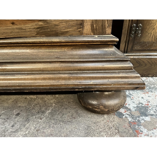 50 - A 19th century carved oak sideboard with three drawers and two cupboard doors - approx. 101cm high x... 