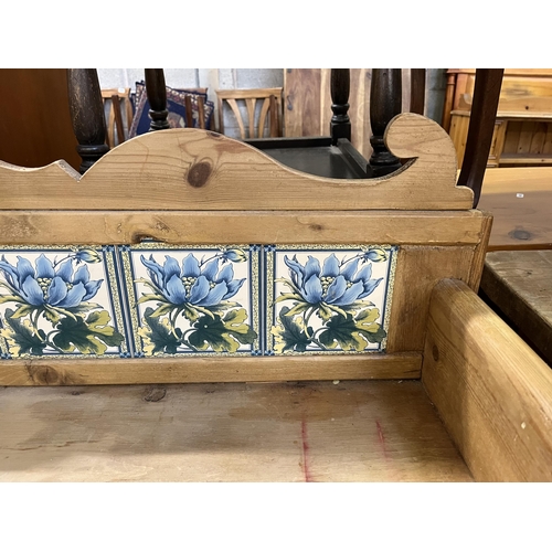 54 - A Victorian pine wash stand with two drawers and ceramic tile inserts