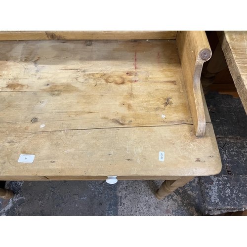 54 - A Victorian pine wash stand with two drawers and ceramic tile inserts