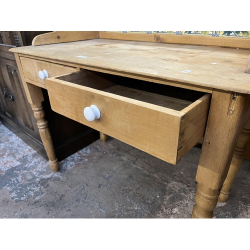 54 - A Victorian pine wash stand with two drawers and ceramic tile inserts