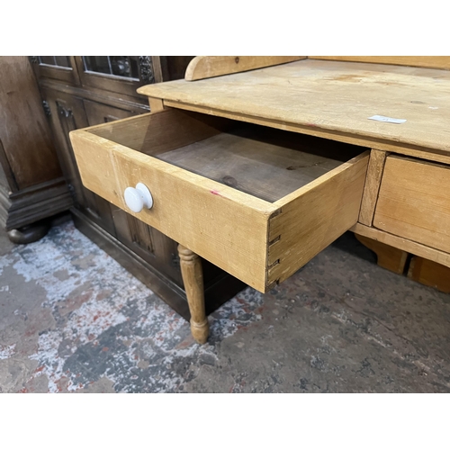 54 - A Victorian pine wash stand with two drawers and ceramic tile inserts