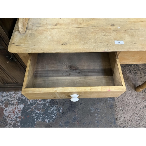 54 - A Victorian pine wash stand with two drawers and ceramic tile inserts