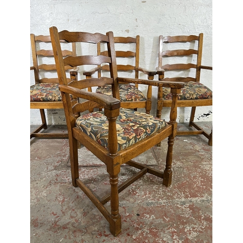 55 - Four 17th century style oak and tapestry upholstered ladder back carver dining chairs