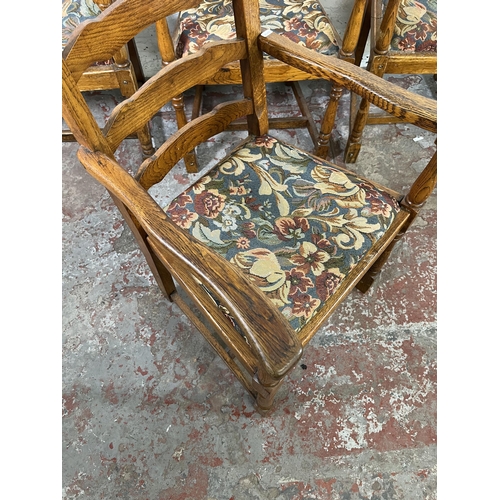 55 - Four 17th century style oak and tapestry upholstered ladder back carver dining chairs