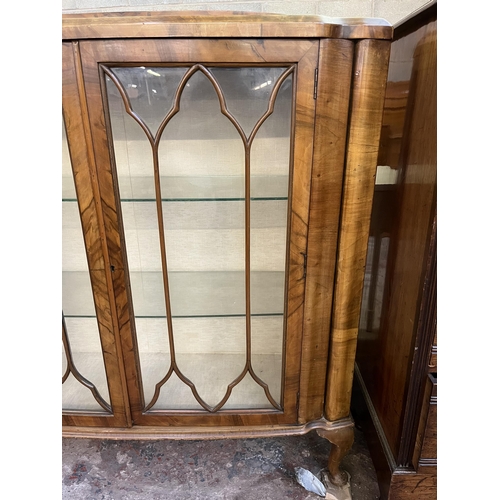 59 - A walnut display cabinet with two glazed doors, two glass shelves and cabriole supports