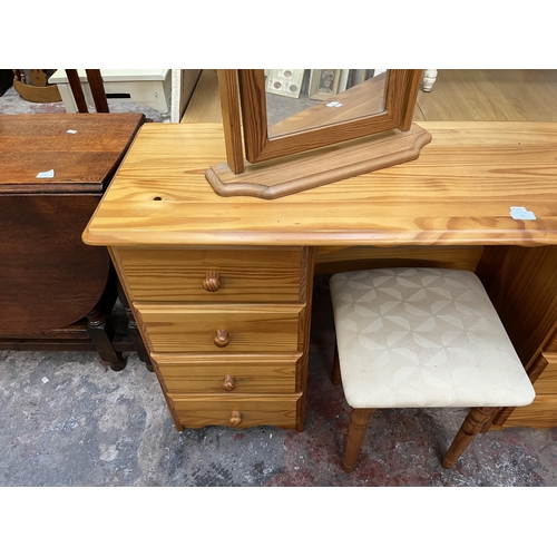 66 - A pine dressing table with mirror and stool