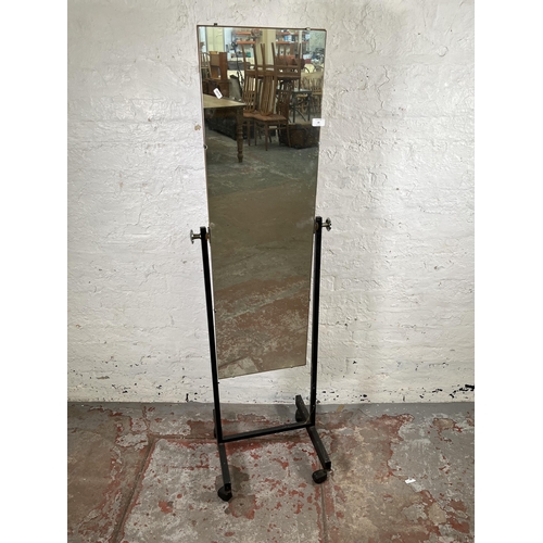 68 - A mid 20th century black metal cheval mirror