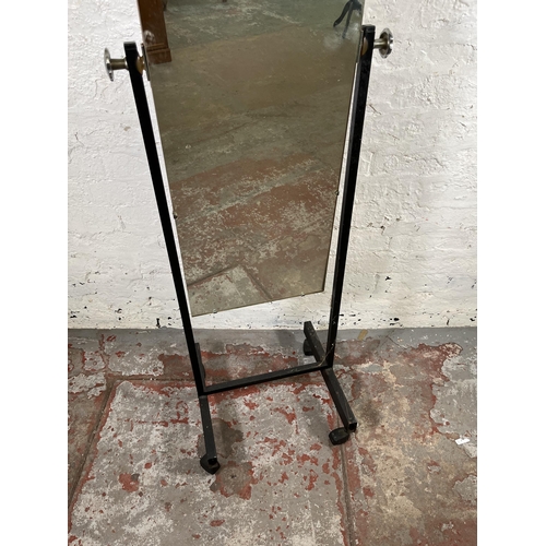 68 - A mid 20th century black metal cheval mirror