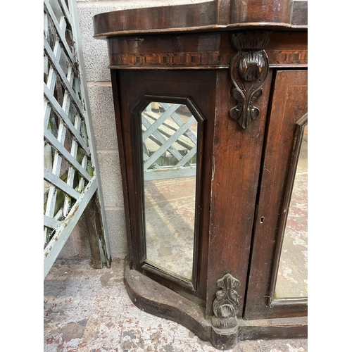 7 - A Victorian inlaid walnut credenza with three mirrored glass cupboard doors