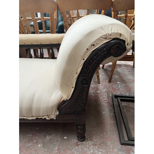 73 - A Victorian carved mahogany and fabric upholstered chaise longue