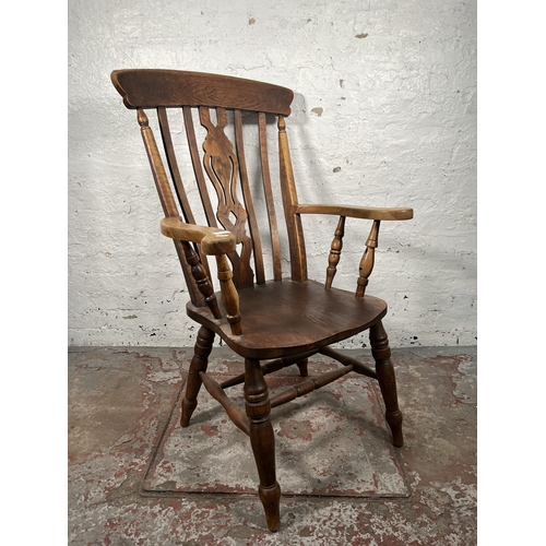 75 - An elm farmhouse grandfather chair