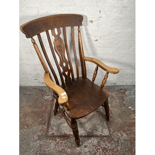 75 - An elm farmhouse grandfather chair