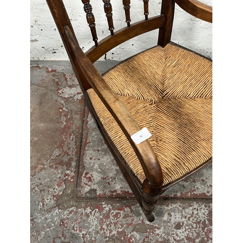 76 - A 19th century beech and rush seated spindle back farmhouse rocking chair