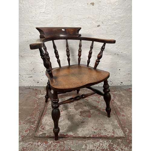 77 - A Victorian elm and beech smoker's bow chair