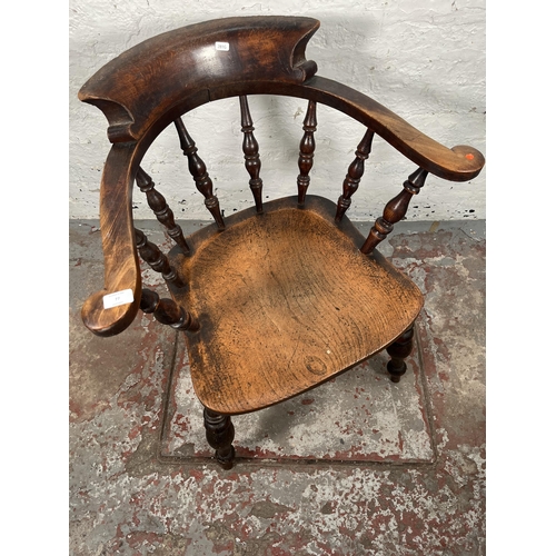 77 - A Victorian elm and beech smoker's bow chair