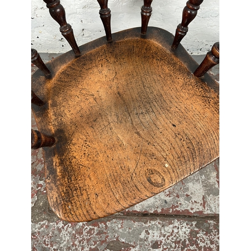 77 - A Victorian elm and beech smoker's bow chair