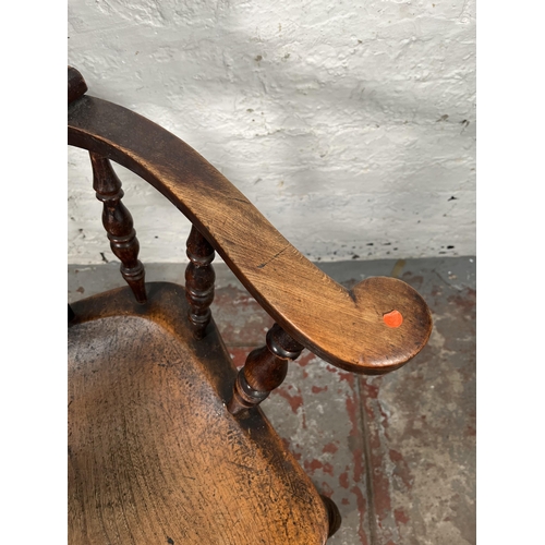 77 - A Victorian elm and beech smoker's bow chair