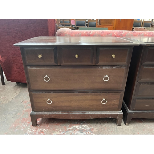 79 - A Stag Minstrel mahogany chest of three short over two long drawers