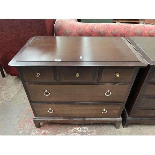 79 - A Stag Minstrel mahogany chest of three short over two long drawers