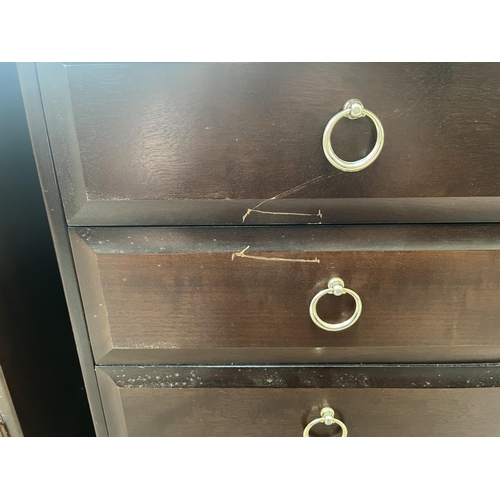 79A - A Stag Minstrel mahogany bedside chest of four drawers