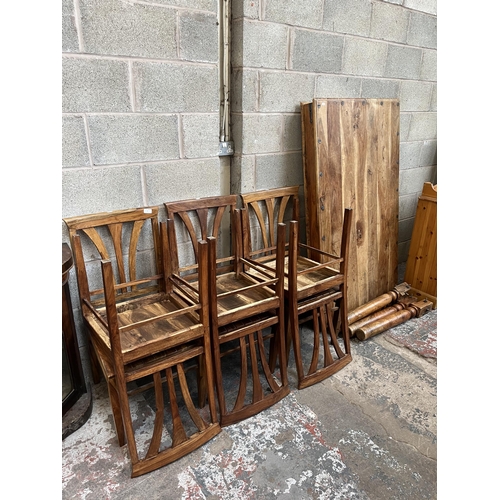 8 - An Indian sheesham wood rectangular dining table and six matching chairs