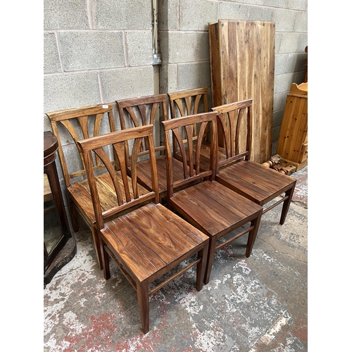 8 - An Indian sheesham wood rectangular dining table and six matching chairs