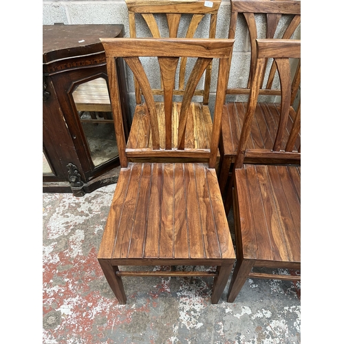 8 - An Indian sheesham wood rectangular dining table and six matching chairs