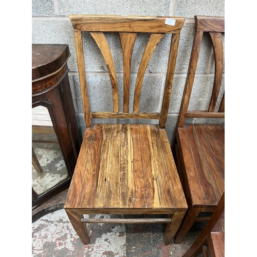 8 - An Indian sheesham wood rectangular dining table and six matching chairs