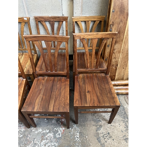 8 - An Indian sheesham wood rectangular dining table and six matching chairs