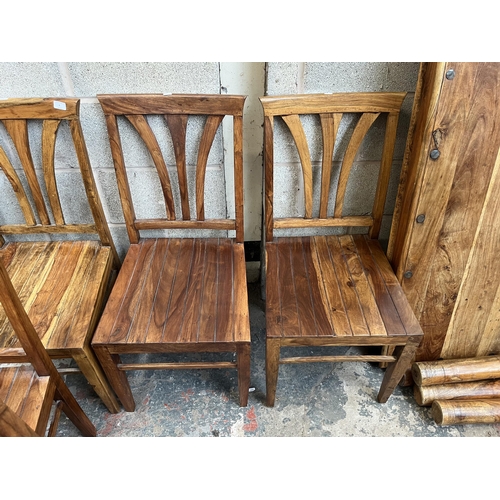 8 - An Indian sheesham wood rectangular dining table and six matching chairs