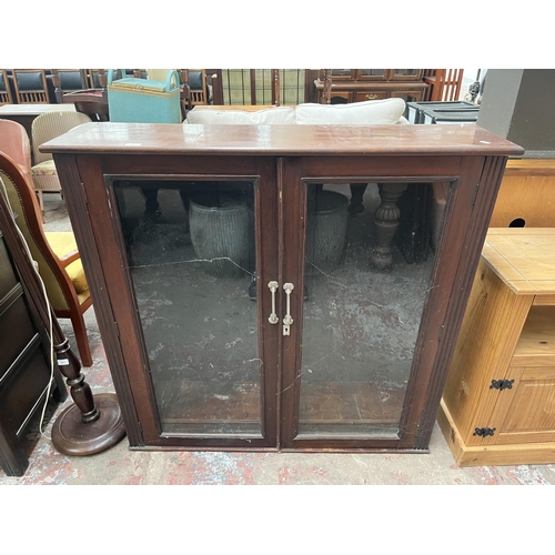 83 - A Victorian mahogany bookcase with two glazed doors and three shelves