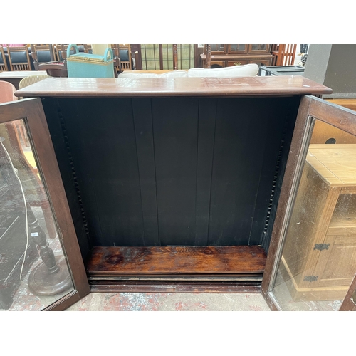 83 - A Victorian mahogany bookcase with two glazed doors and three shelves