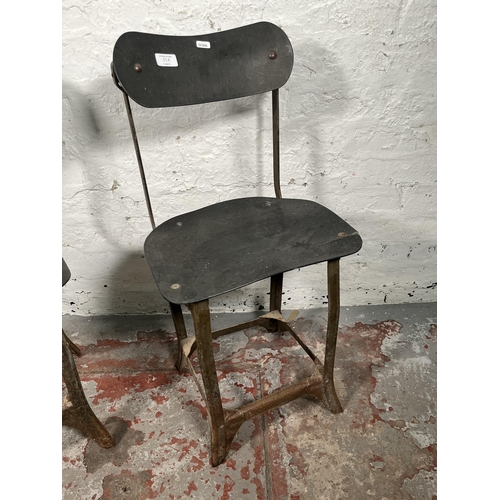 85A - A pair of 1950s Tan-Sad style fibreboard and cast metal industrial factory chairs