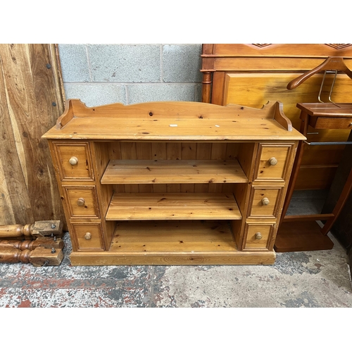 9 - A solid pine sideboard with six drawers and two shelves - approx. 92cm high x 121cm wide x 30cm deep