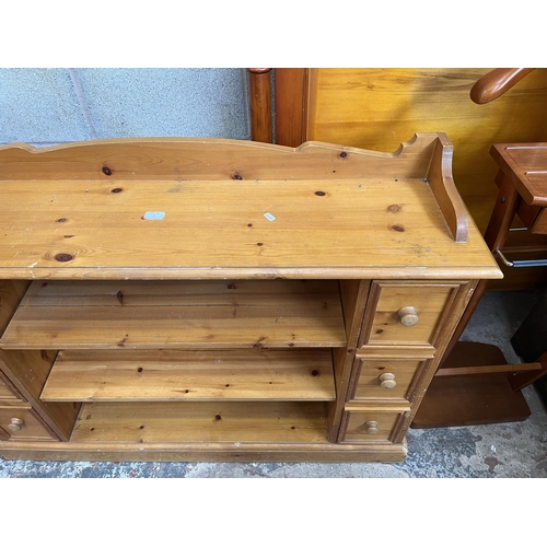 9 - A solid pine sideboard with six drawers and two shelves - approx. 92cm high x 121cm wide x 30cm deep