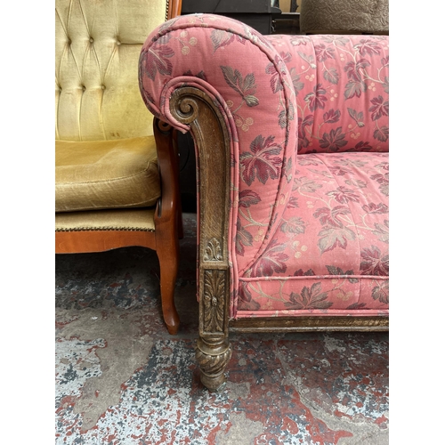 90 - A Victorian carved oak and fabric upholstered three seater sofa