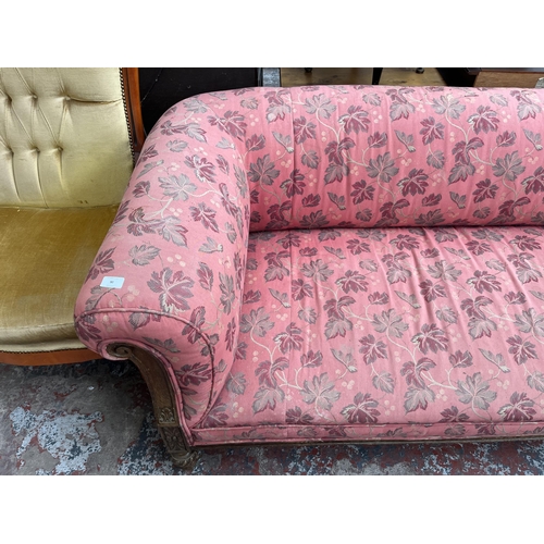 90 - A Victorian carved oak and fabric upholstered three seater sofa