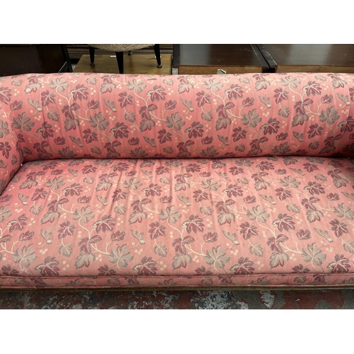 90 - A Victorian carved oak and fabric upholstered three seater sofa