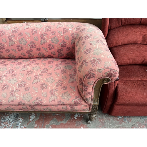 90 - A Victorian carved oak and fabric upholstered three seater sofa