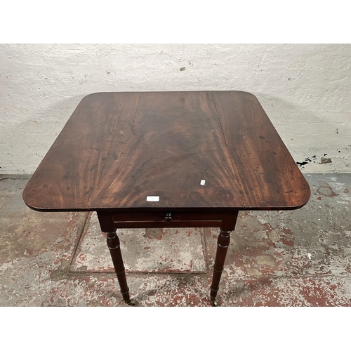 93 - A Georgian mahogany drop leaf Pembroke table with brass castors