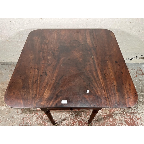 93 - A Georgian mahogany drop leaf Pembroke table with brass castors