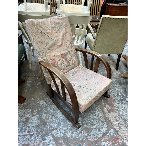 101 - A 1930s bentwood and fabric upholstered rocking armchair